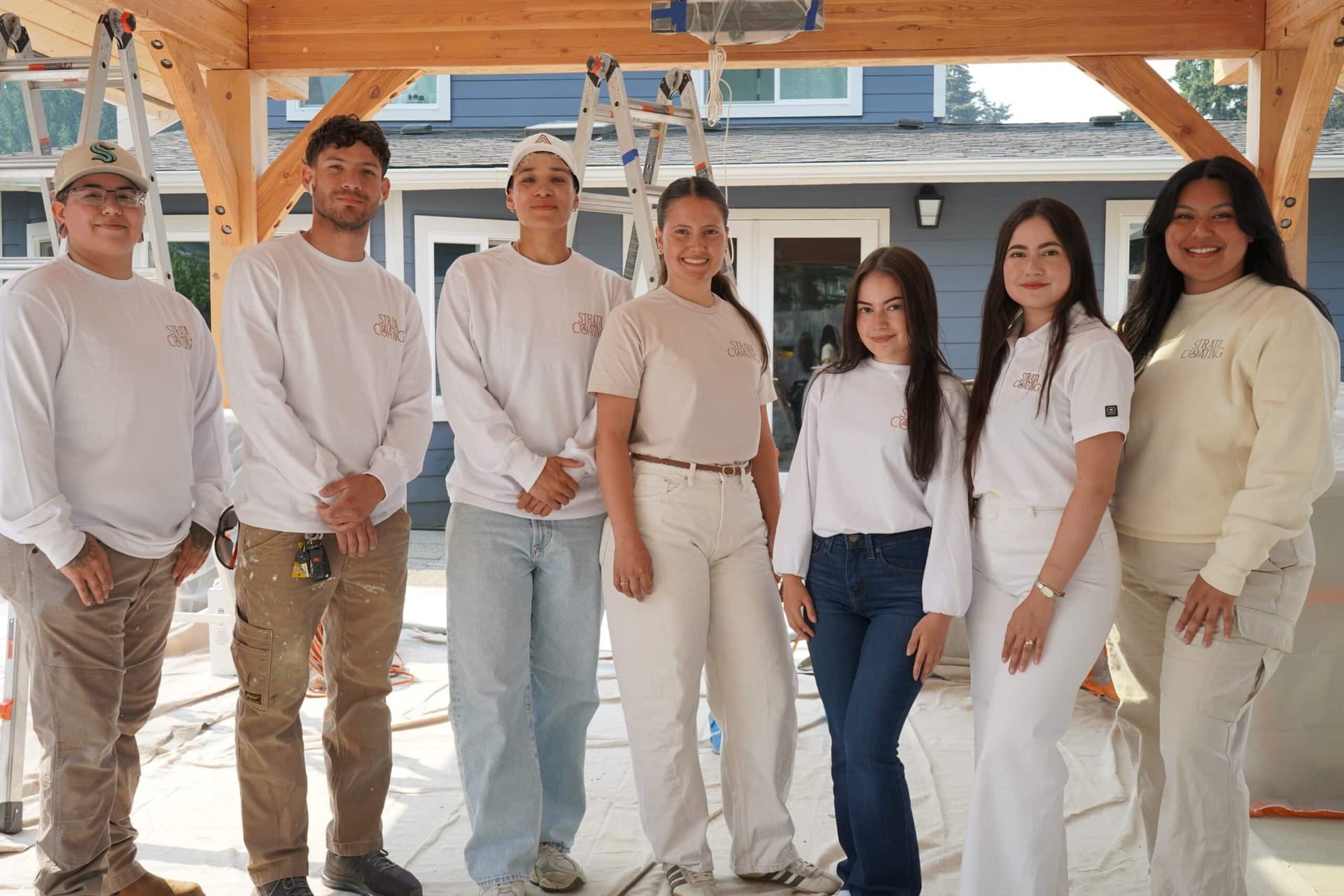 Strata Coating full team posing at a job site